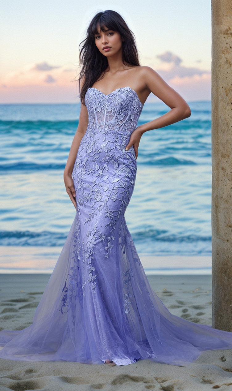 A woman in the Strapless Sweetheart Long Mermaid Prom Dress 7024 poses on a sandy beach near the ocean at sunset.